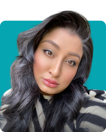 Woman with long black hair and striped shirt on teal background